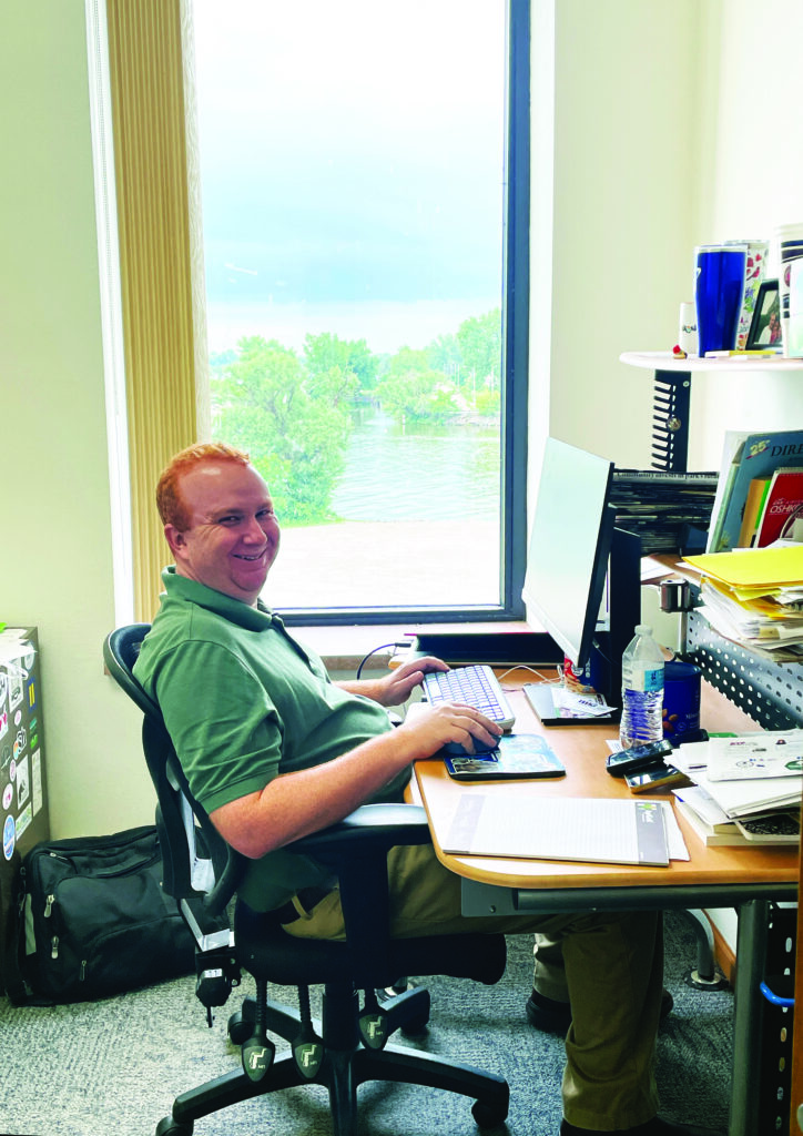 The editor of Winnebago Media Group, Chris, at his desk.